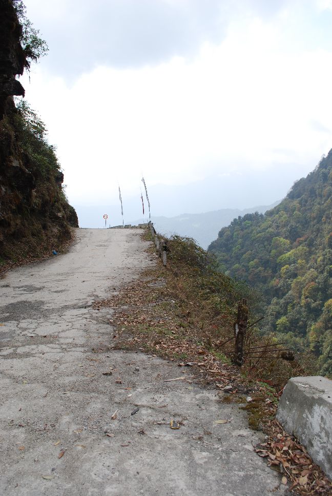 photo: mountain road falling away into steep drop.