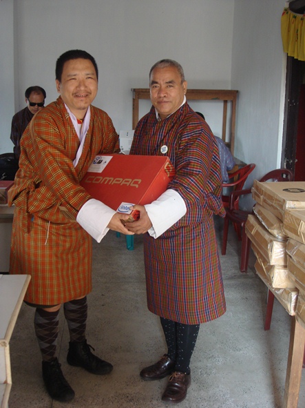 photo: Student receiving laptop at the in-service course in 2010.