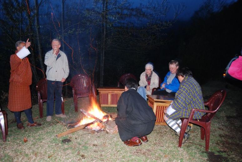 photo: Welcome party at Khaling, Einar and the Principal, Reidunn, Morten, Kuenga and Kelzang sitting around the fire.