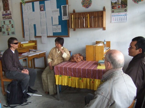 [Photo: Magne, Nils and Pema talking to Tshering Yedon]