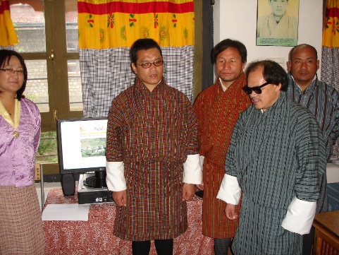 [Photo: Tshering, Pema, Kuenga and others proudly demonstrate NIVI's home page]